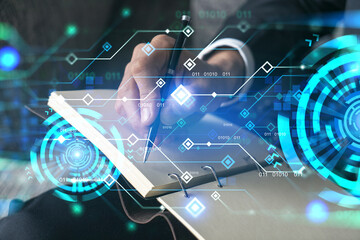 Businessman in suit taking notes. Double exposure with binary tech theme hologram. Man writing down important information in his business diary.