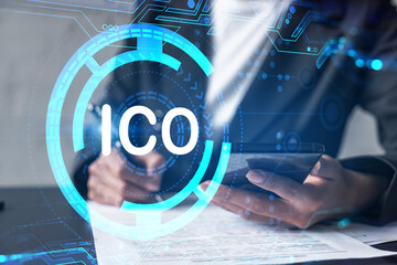ICO hologram and a woman signing contract use phone. Double exposure. initial coin offering concept.