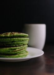 Healthy breakfast kale pancakes and coffee