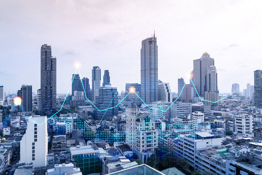 Financial stock chart hologram over panorama city view of Bangkok, business center in Asia. The concept of international transactions. Double exposure.
