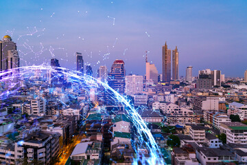 Hologram of abstract technology glowing icons, panoramic cityscape of Bangkok at sunset, Asia. The concept of worlds technological changes. Double exposure.