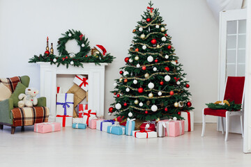 Christmas tree with fireplace interior of white room new year decoration garland gifts