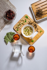 Chinese tea party. Dry granules of different types of tea. Flatlay, top view. herbal tea, on a white background. vertical photo