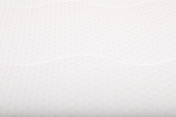 Modern comfortable orthopedic mattress as background, closeup