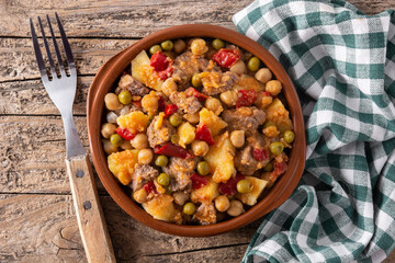 Ropa vieja food in bowl on rustic wooden table