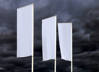 Three  white blank  banners against a dramatic stormy dark  sky. Background for copy space