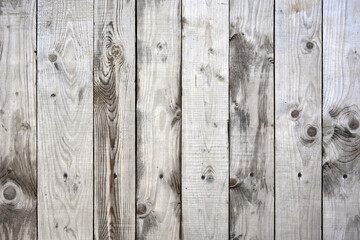 Background of vertical wooden boards. Wooden surface after rain. Wet boards.