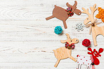 Top view of Christmas decorations and toys on wooden background. Copy space. Empty place for your...