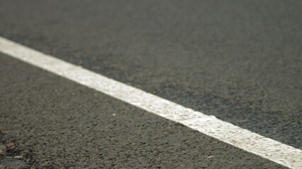 Fototapeta premium Road marking, Construction of a new road. Road surface repair.