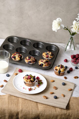 Fototapeta na wymiar mixed berry low carb Keto Diet muffin with almond and nut. set on cafe table.