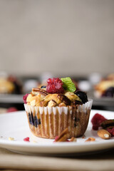 mixed berry low carb Keto Diet muffin with almond and nut. set on cafe table.