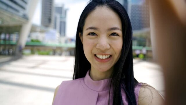 Businesswoman with black hair smiling and looking at camera, beauty, confidence, happiness - 4K High Quality Footage