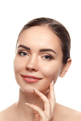 Beautiful Young Woman with Clean Fresh Skin touch own face . Facial treatment. Beauty and spa . Skin Care. Cosmetics.Makeup,