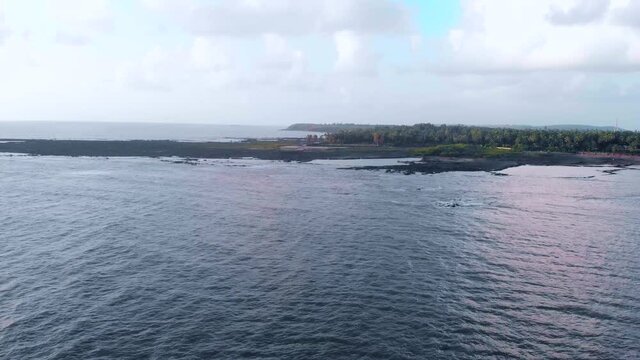 gorai beach dock waves on sun set dron shot birds panorama view