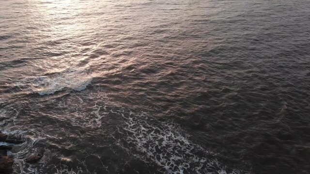 gorai beach dock waves on sun set dron shot birds eye view