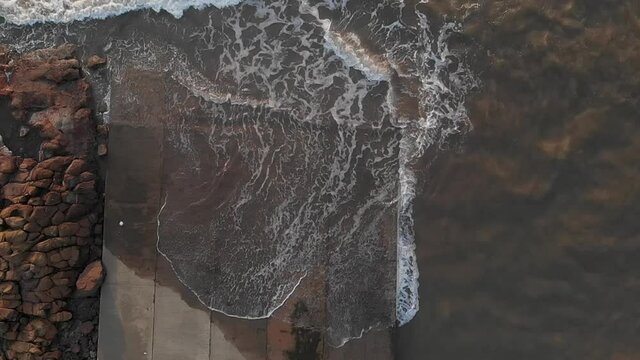 sea waves crashing over doc top view gorai uttan  indian slow motion