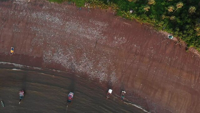 gorai beach  waves on sun set fishing ships adn sea weast dron shot.