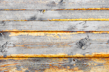 Wooden texture of grey color with scratches and cracks, which can be used as a background