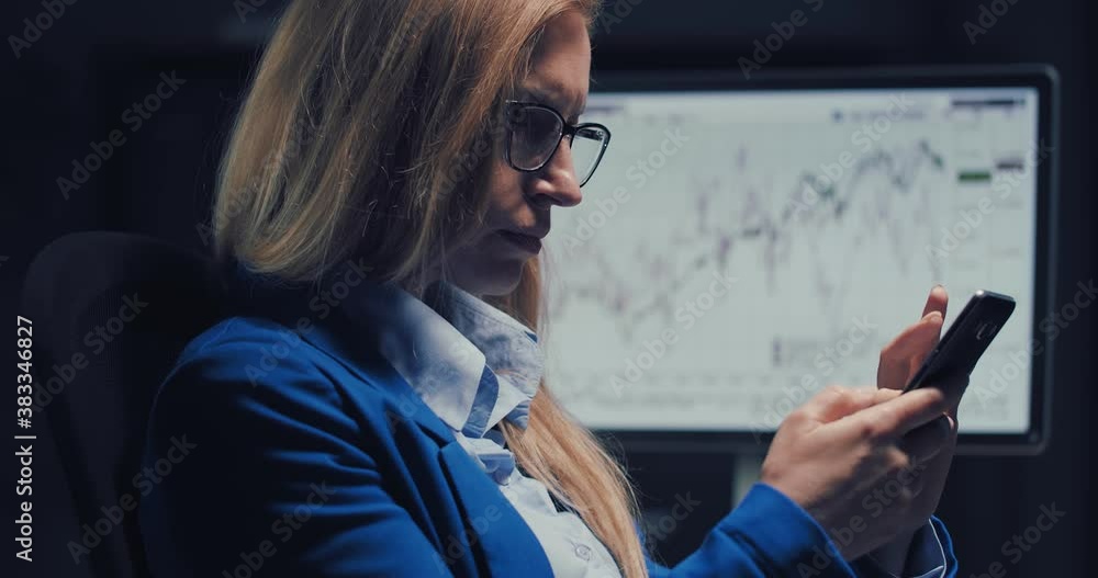 Poster side view of concentrated business lady with blond hair using modern smartphone while sitting at off