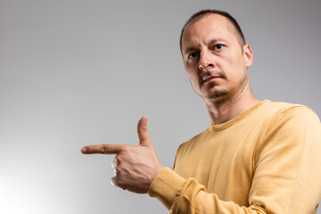Enthusiastic handsome guy inviting to check-out event, 