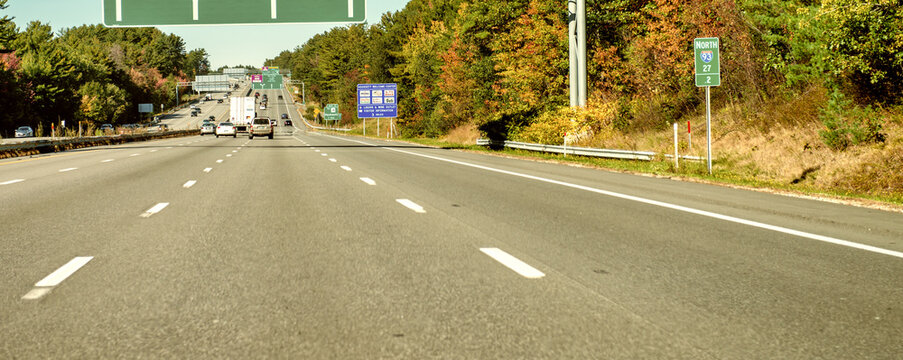 HOOKSETT, NH - OCTOBER 8, 2015: New England interstate signs in foliage season