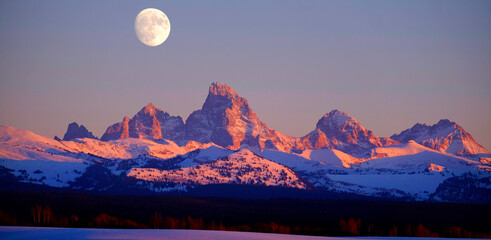 Sunset Light Alpen Glow on Tetons Teton Mountains wtih Moon Rising - Powered by Adobe