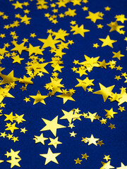 Blue moody background with golden stars.