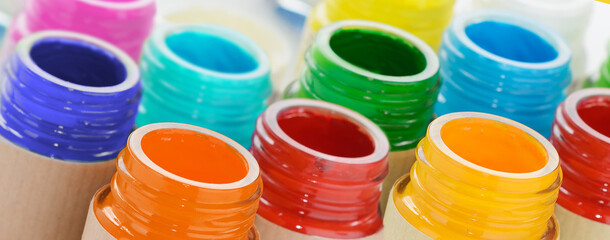 Jars with multicolored paints.