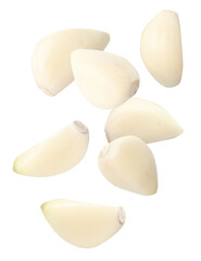 Many garlic cloves falling on white background