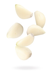 Many garlic cloves falling on white background
