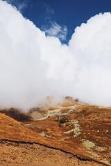 Cloudy day in mountains, clouds descend from the mountains to the village from above. ascent by cable car