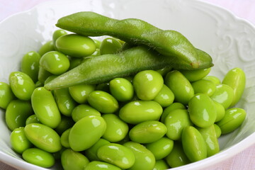Fresh Green Peas in a White Bowl