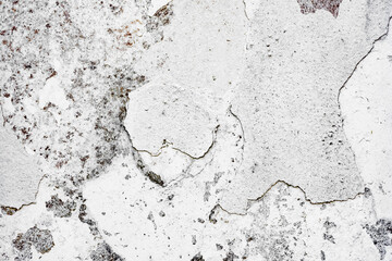 Texture of a concrete wall with cracks and scratches which can be used as a background