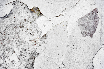 Texture of a concrete wall with cracks and scratches which can be used as a background