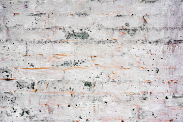 Texture of a brick wall with cracks and scratches which can be used as a background