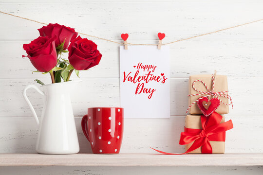 Valentines day card with gift and flowers