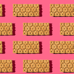 Photo seamless pattern of orange color loaves for healthy food with shadows on a colored background.