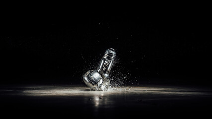 shattered light bulb in the dark