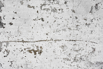 Texture of a concrete wall with cracks and scratches which can be used as a background