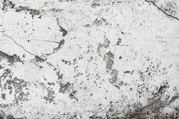 Texture of a concrete wall with cracks and scratches which can be used as a background