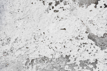 Texture of a concrete wall with cracks and scratches which can be used as a background