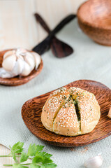 Korean Garlic Bread on Wood plate with Garlic Wood Background
