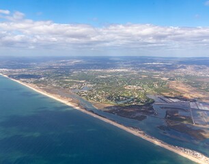 aerial of Faro with harbor and beach