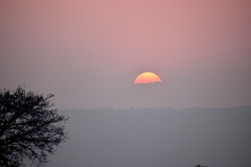 sunset in the sky,sunset over the hills