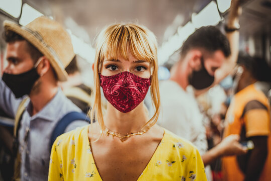 Woman wearing mask travelling in the subway during covid-19 pandemic
