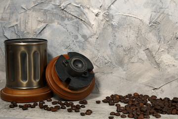 mechanical coffee grinder and coffee beans on a background