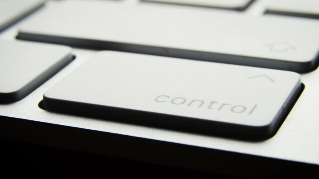 Pressing the control button on a computer keyboard. Macro close-up