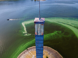 Aerial view of the lighthouse surrounded by algal bloom