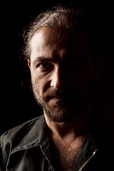 Close up portrait of a serious pensive middle-aged bearded man
