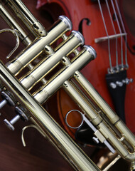 Detail of a trumpet and violin - background 